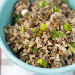 brown rice and lentils in a blue bowl