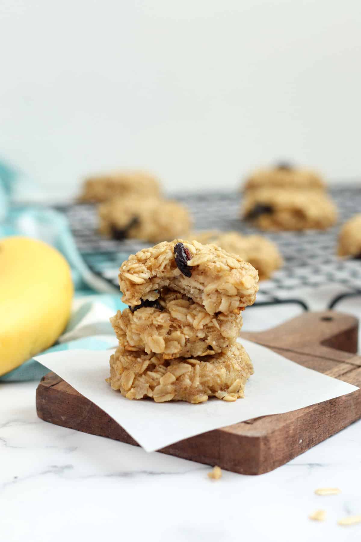 a stack of sugar free cookies on a wooden board