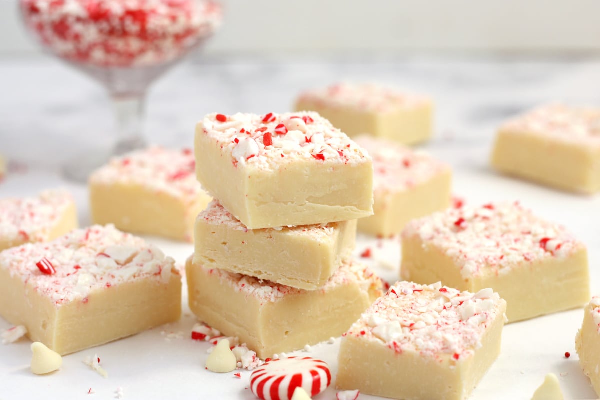 squares of white peppermint fudge stacked together