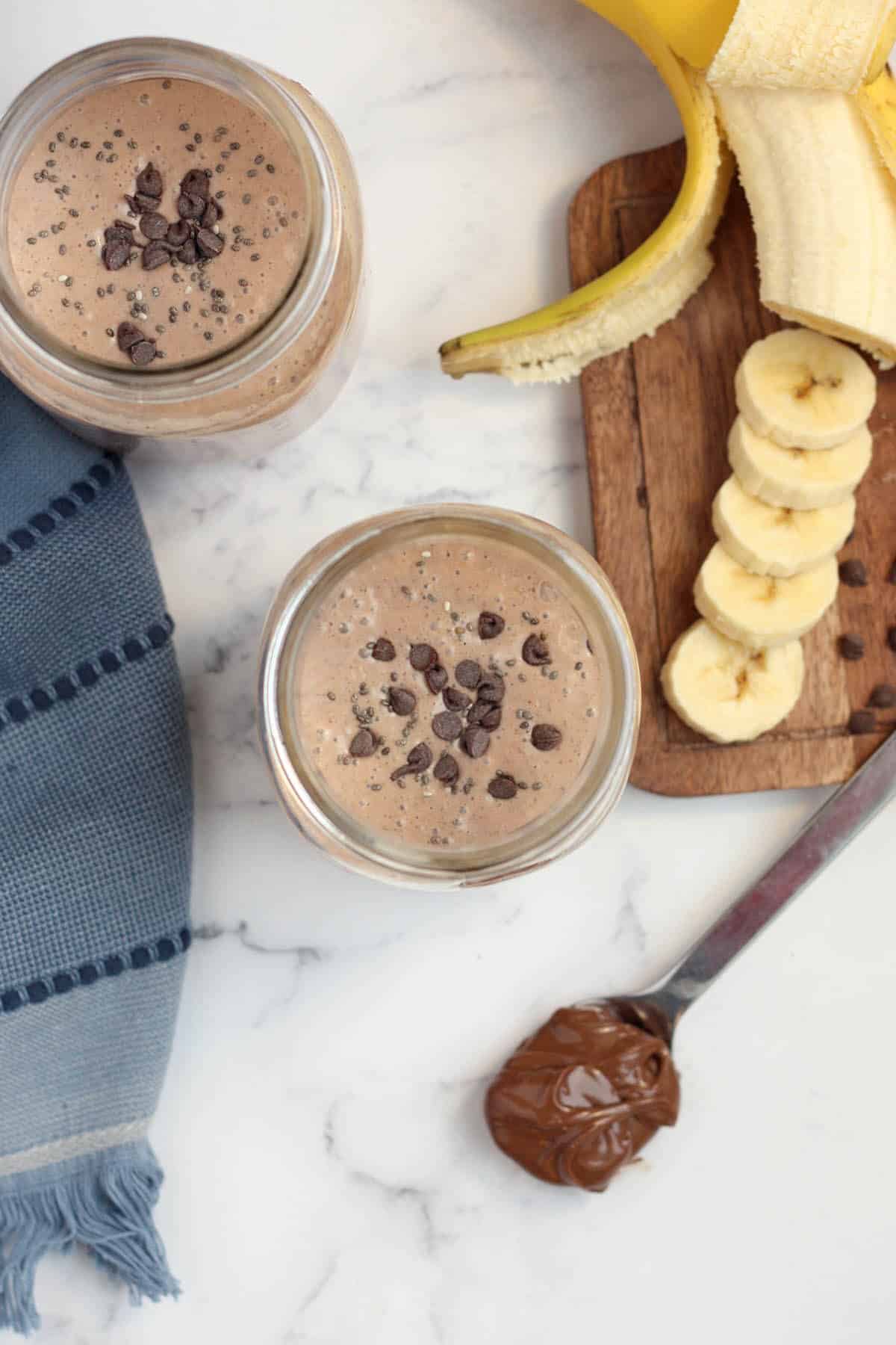 chocolate protein shake topped with chocolate chips and chia seeds