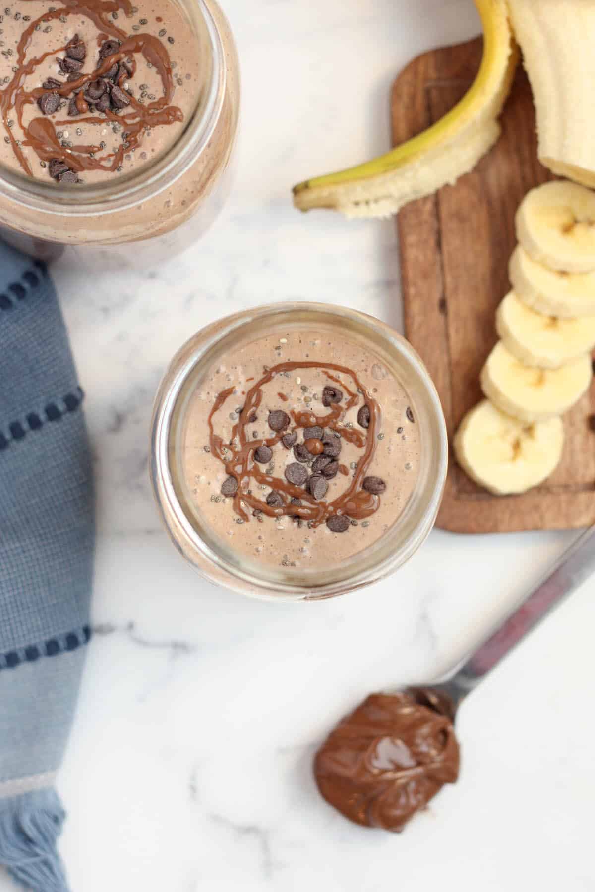 chocolate protein shake topped with mini chocolate chips and chia seeds