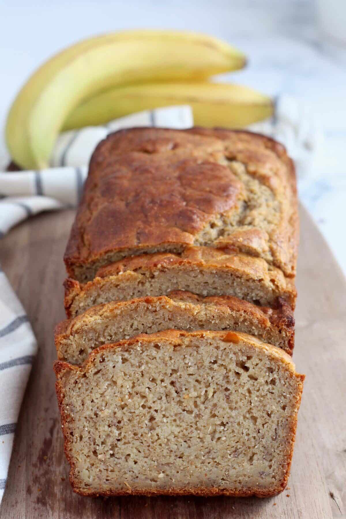 healthy banana bread recipe sliced on a cutting board