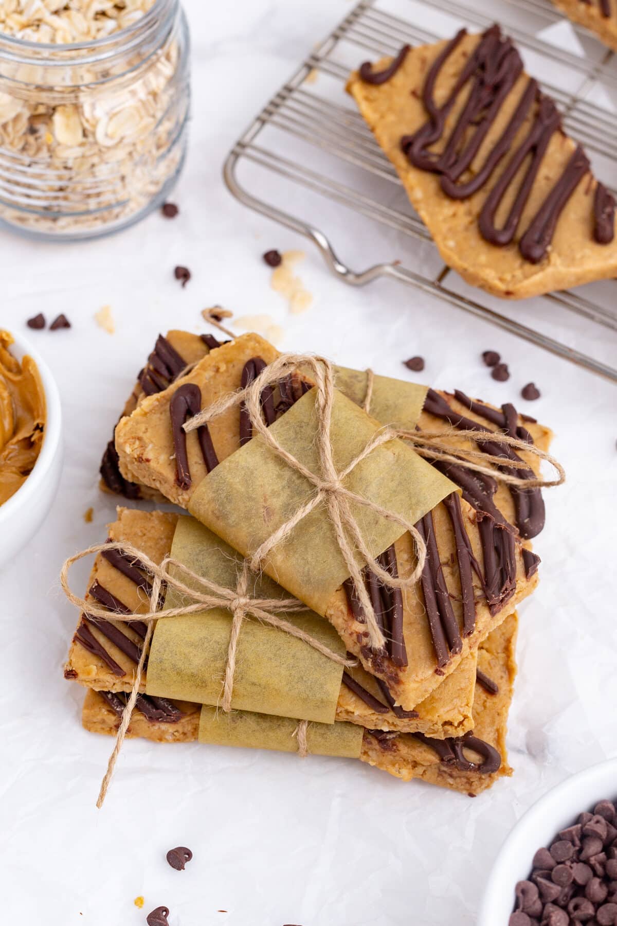 a stack of homemade protein bars tied with parchment and twine