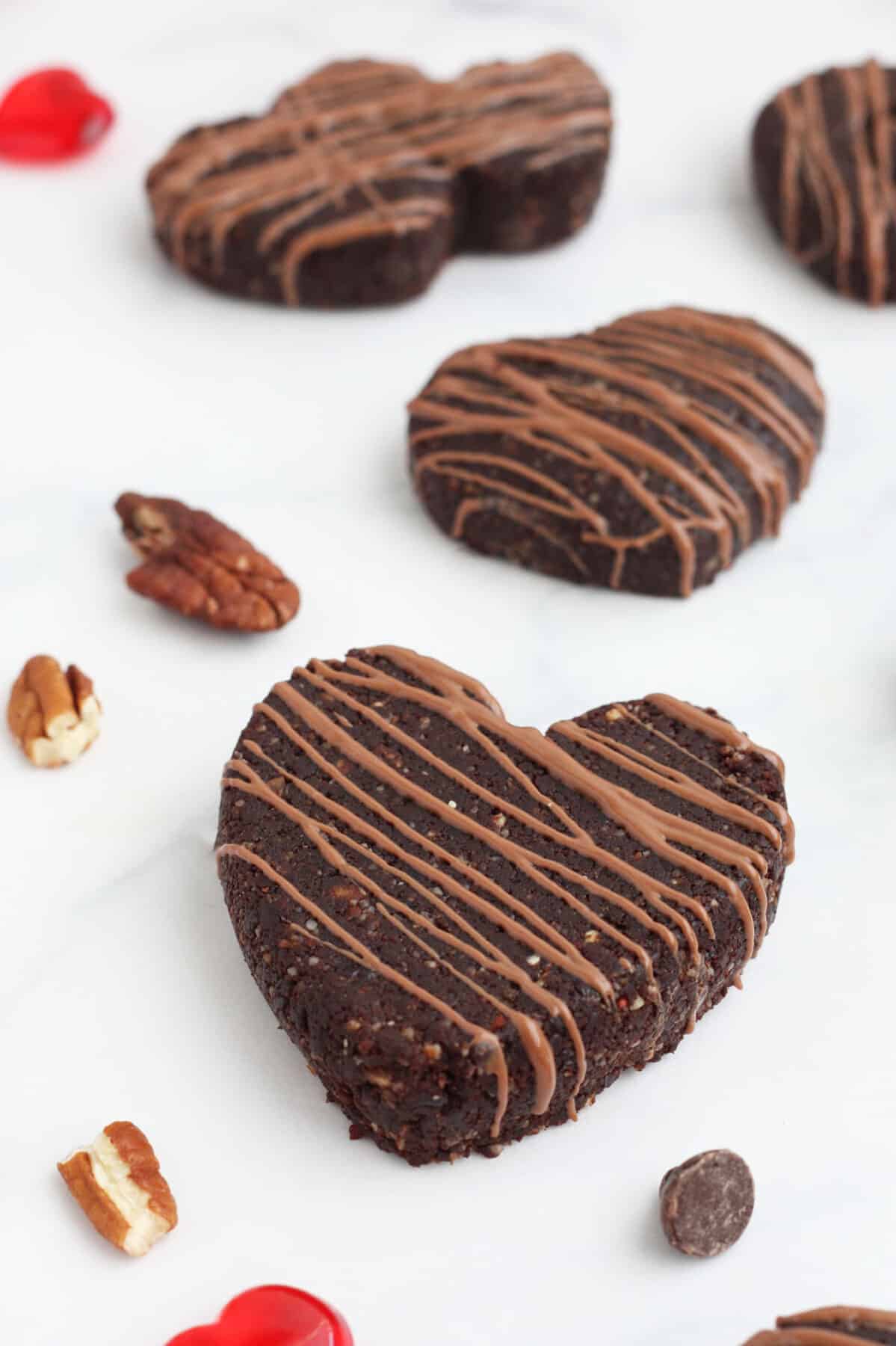 chocolate rx bars in the shape of hearts and drizzled with chocolate