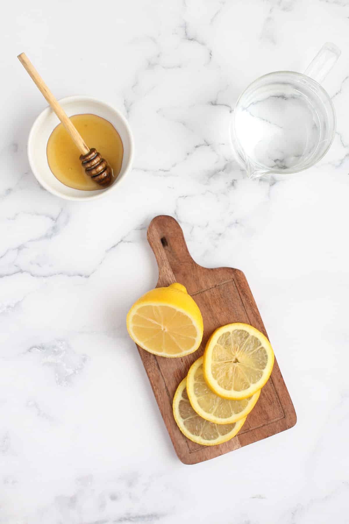 Ingredients for cold remedy with honey and lemon.