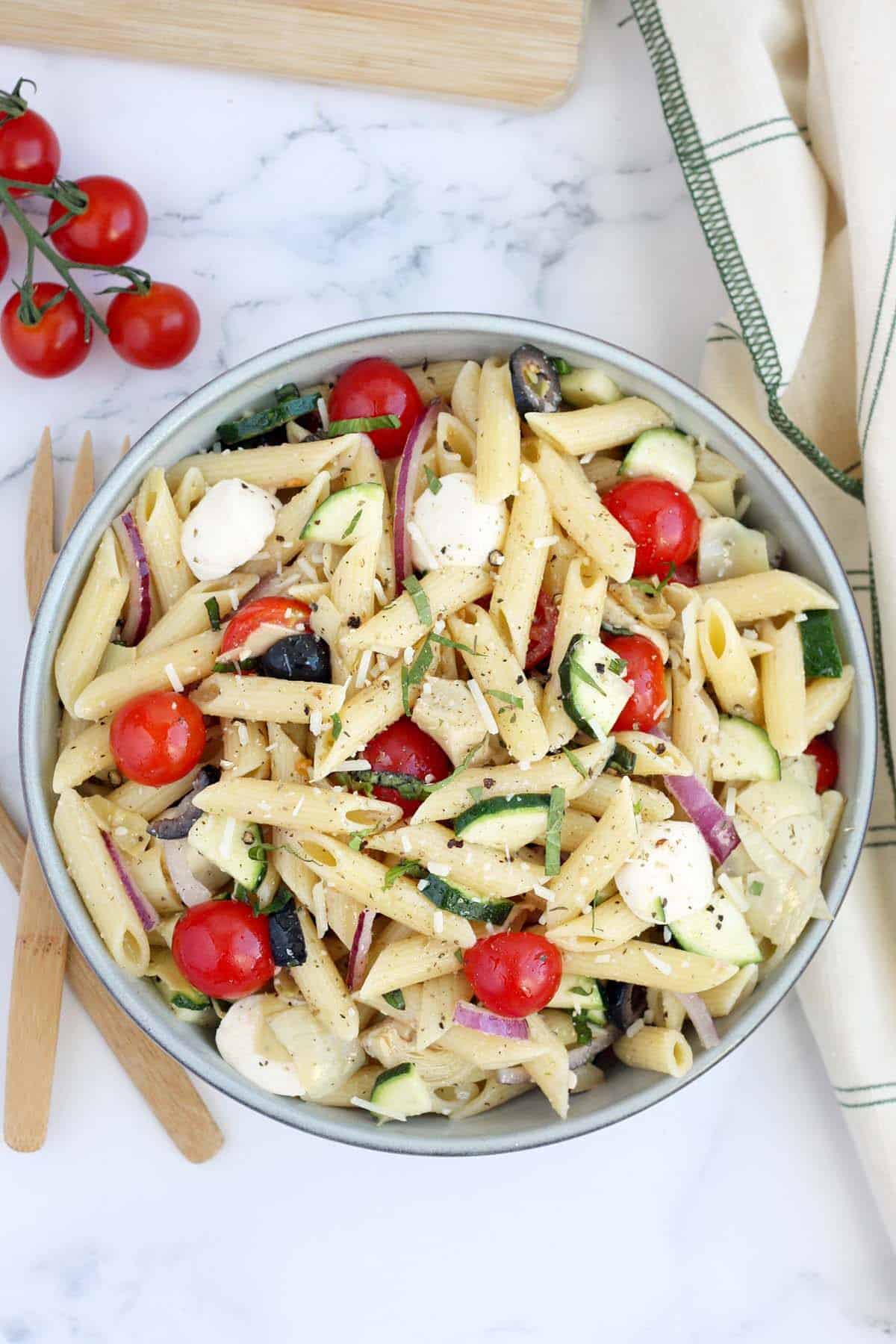 an overhead shot of italian pasta salad with fresh tomatoes