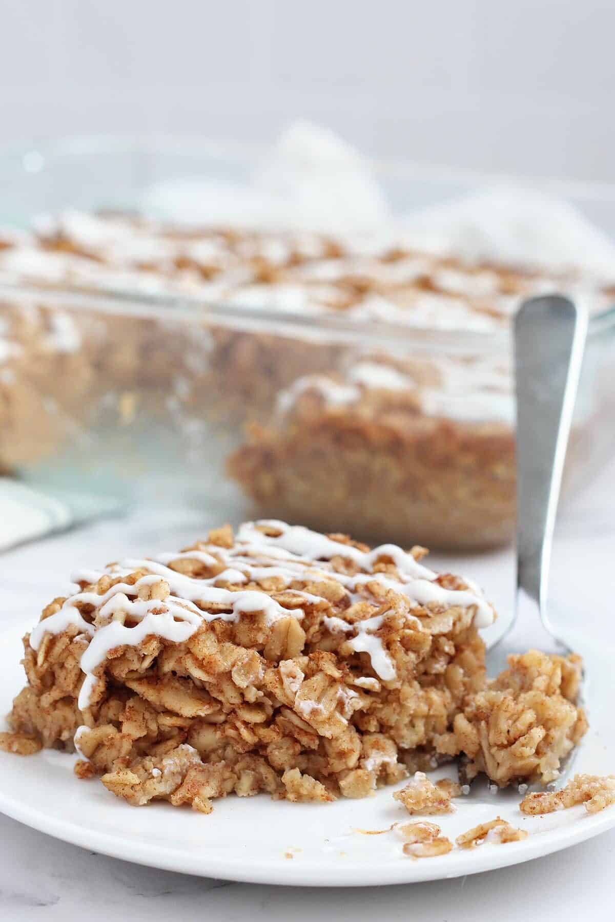 a closeup of a serving of baked oatmeal on a white plate