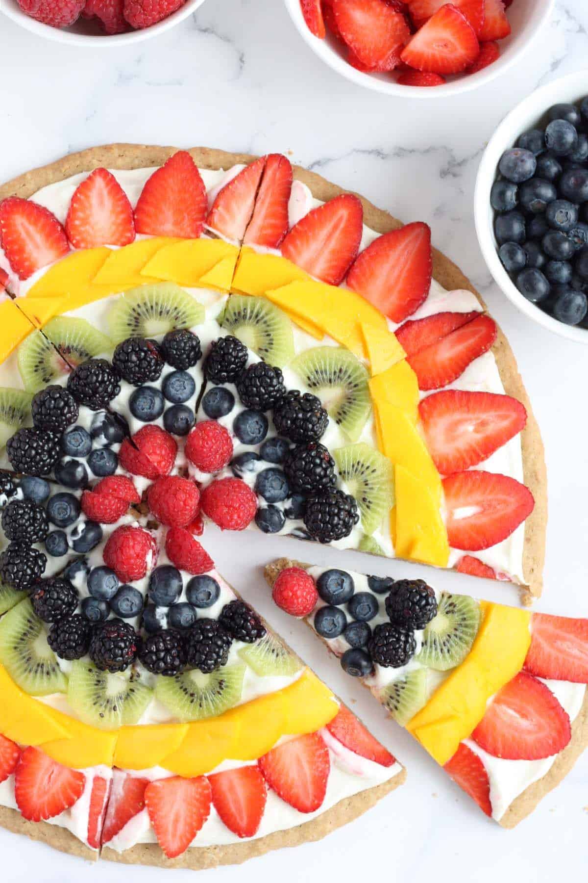 fruit pizza with oatmeal cookie crust cut into slices