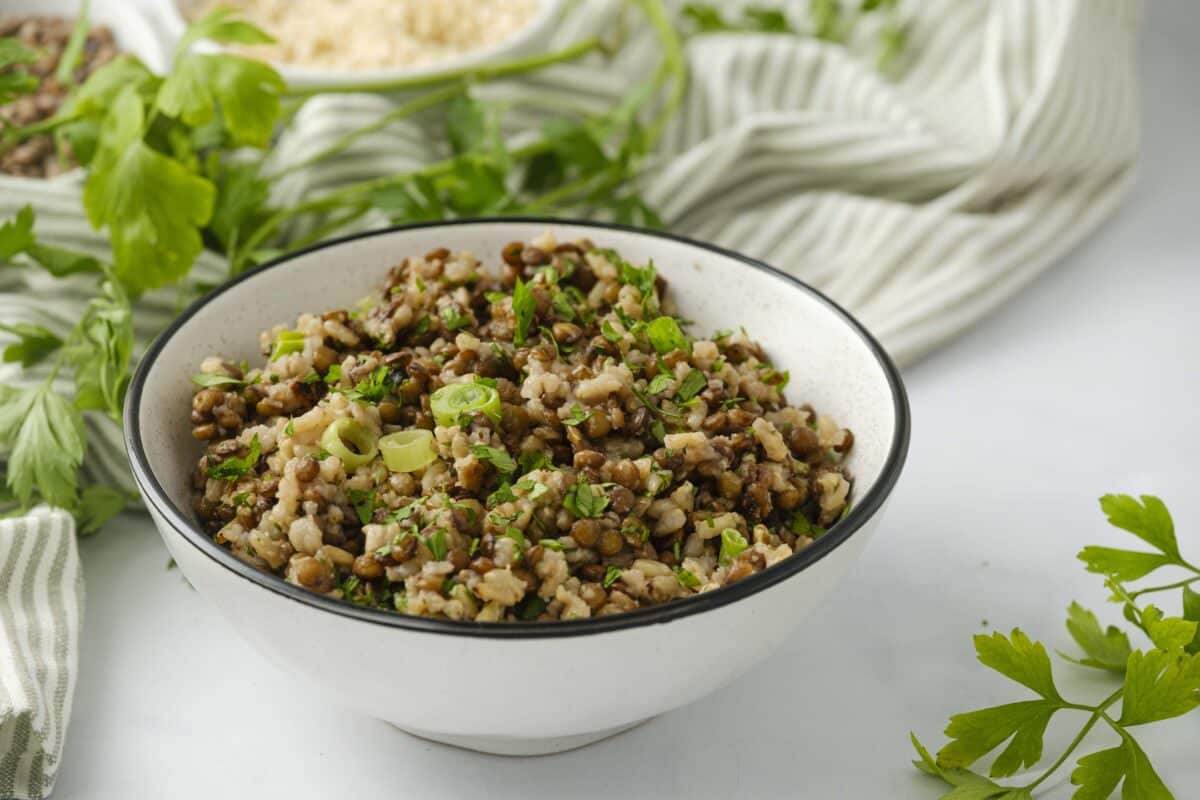 Lentils and rice in a white serving bowl