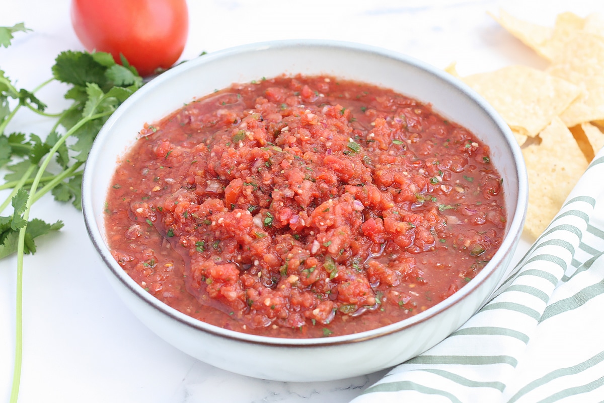 a serving bowl of homemade tomato and cilantro salsa