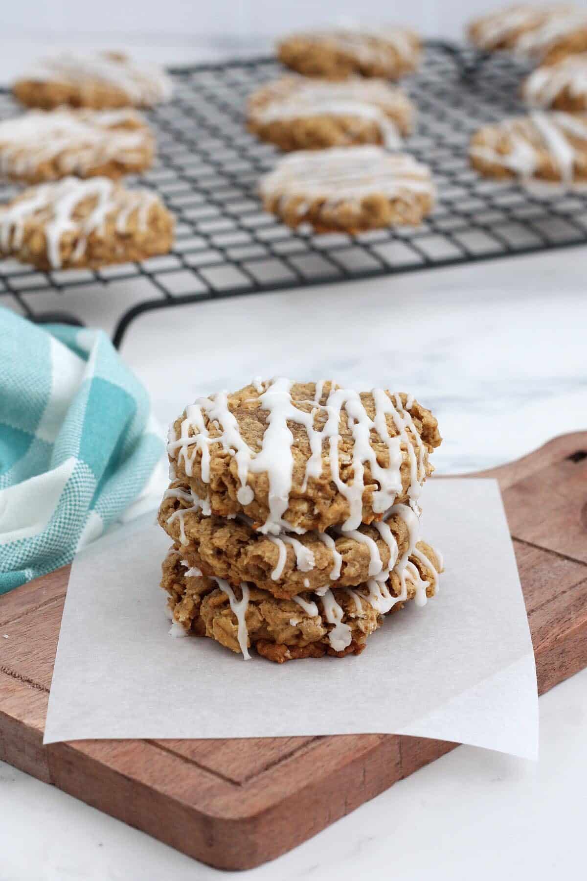 a stack of frozen oatmeal cookies on a wooden board
