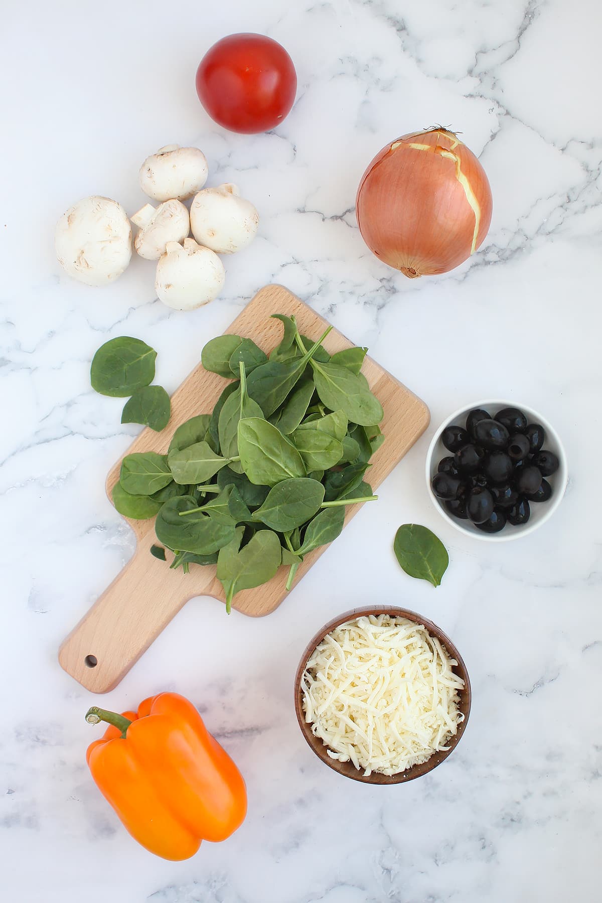 Ingredients for homemade veggie pizza.