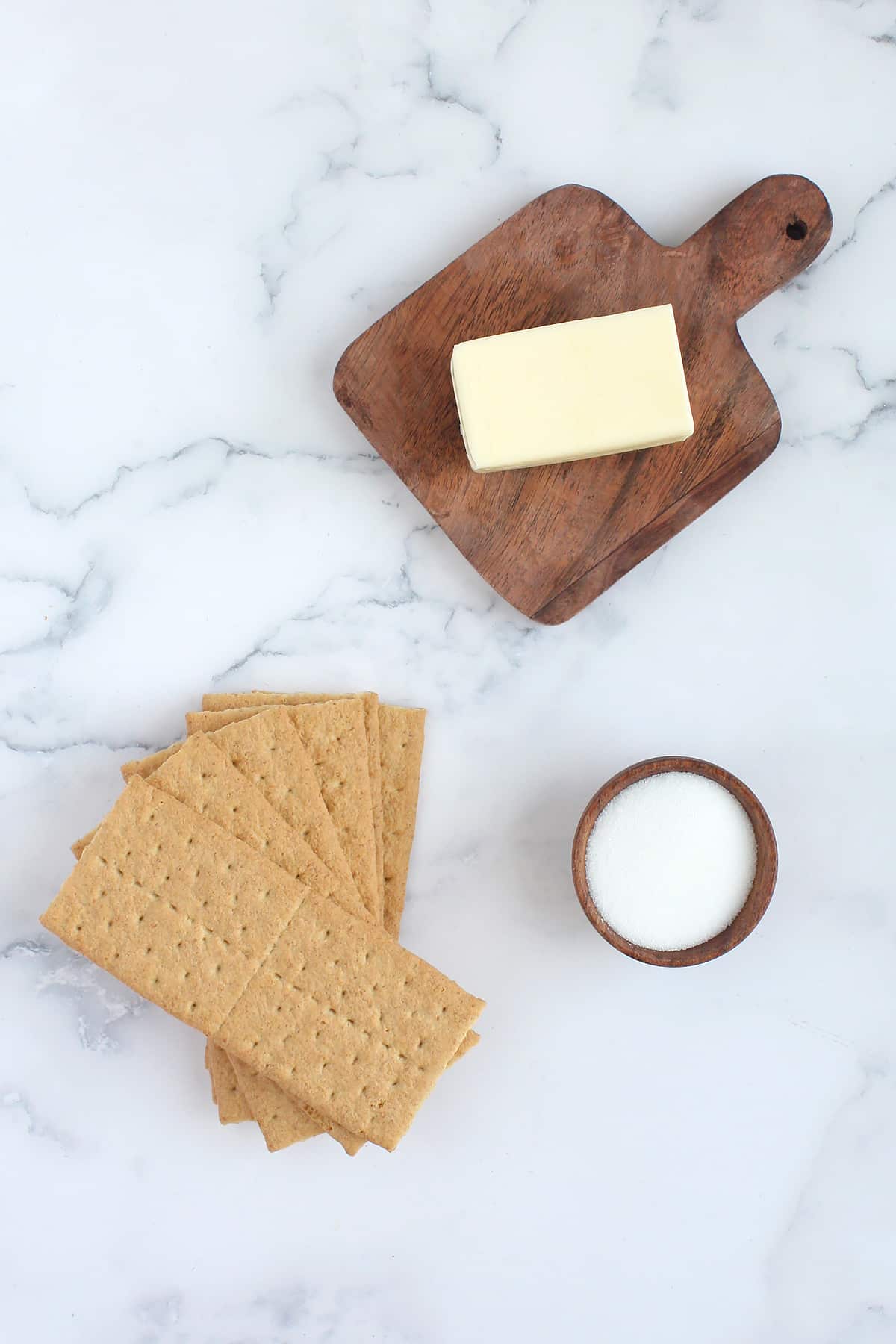 Ingredients you need to make a homemade graham cracker pie crust.