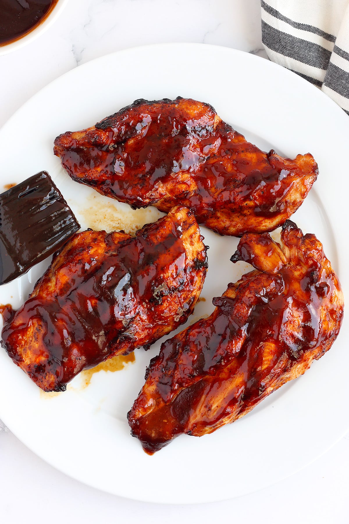 BBQ chicken with char marks and glossy bbq sauce with a
