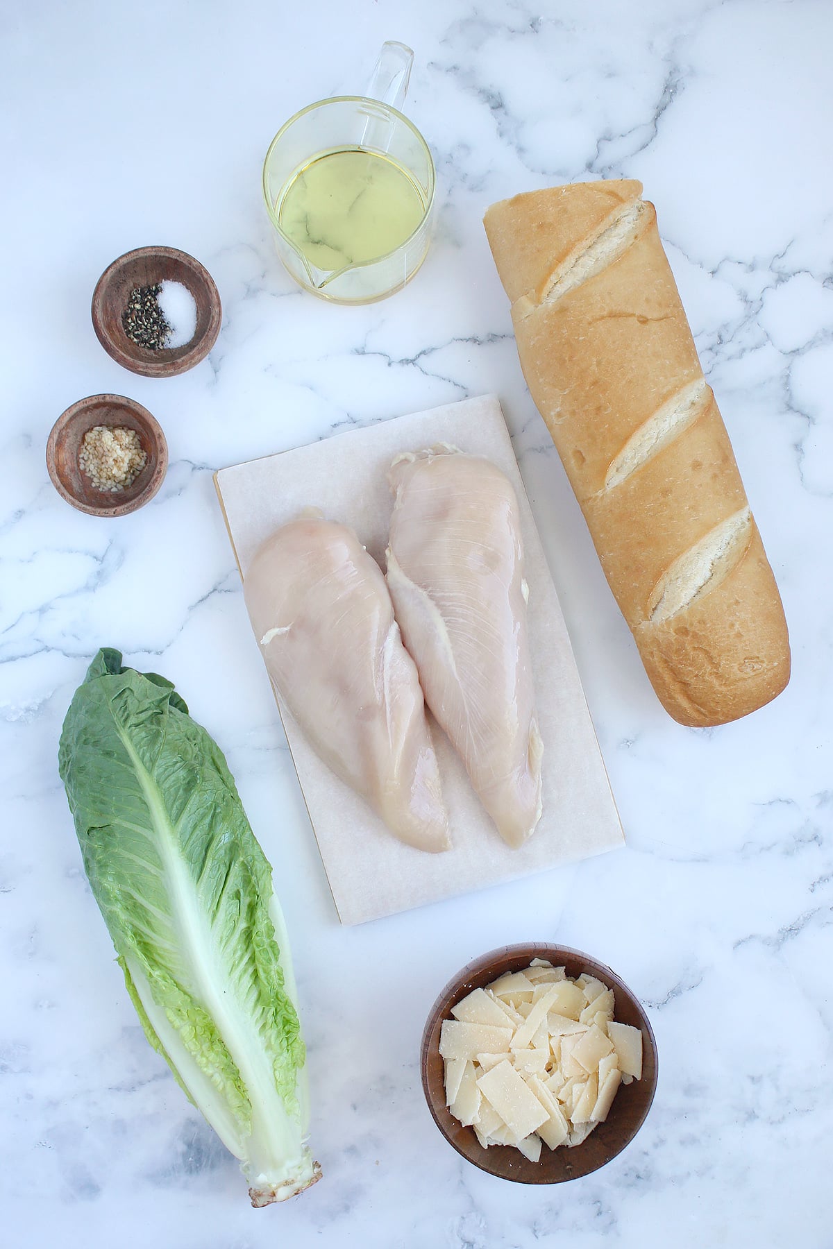 Ingredients used to make chicken caesar salad.