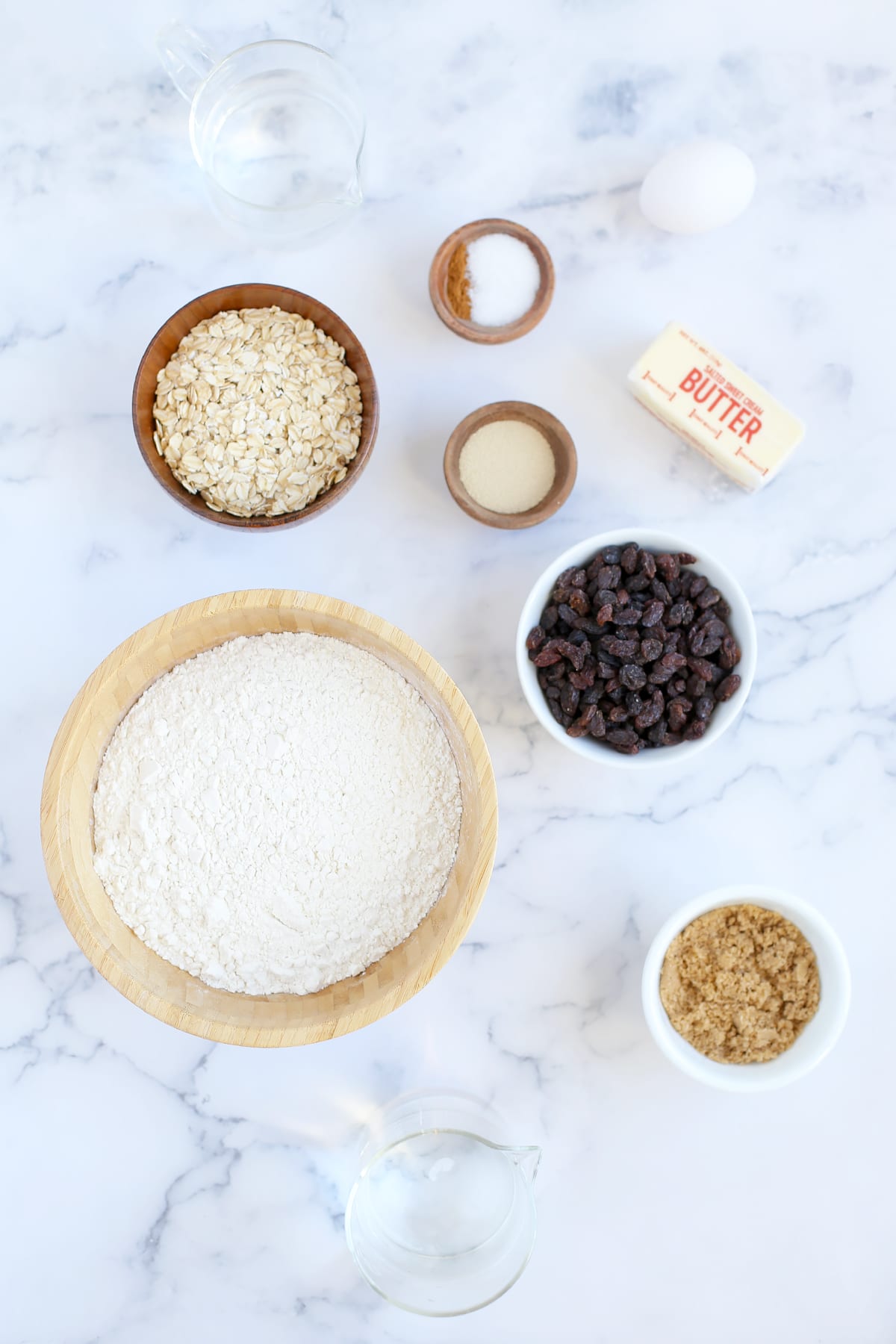 Ingredients needed to make homemade cinnamon raisin bread.