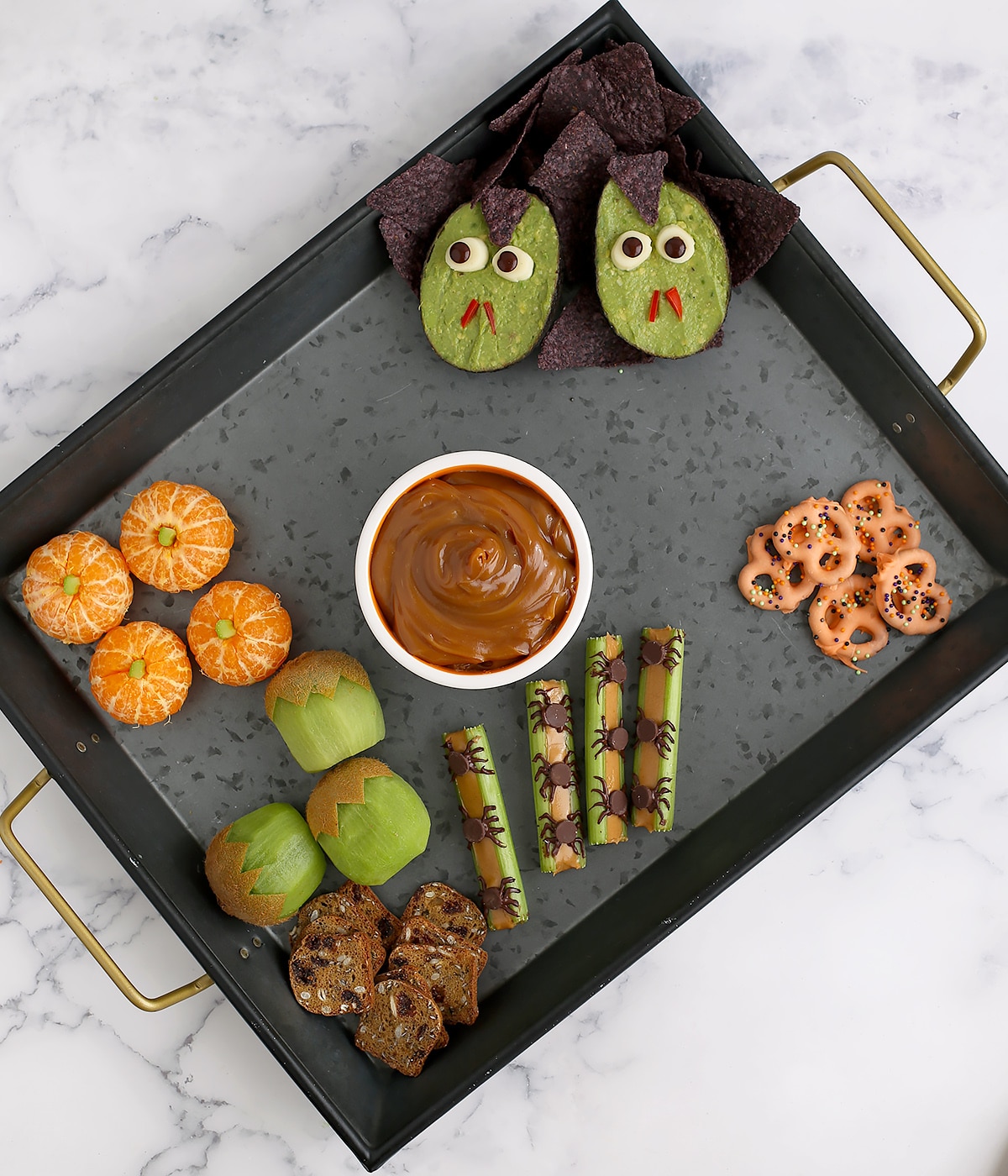 https://www.superhealthykids.com/wp-content/uploads/2023/10/fun-and-healthy-halloween-snack-tray-process-2.jpg