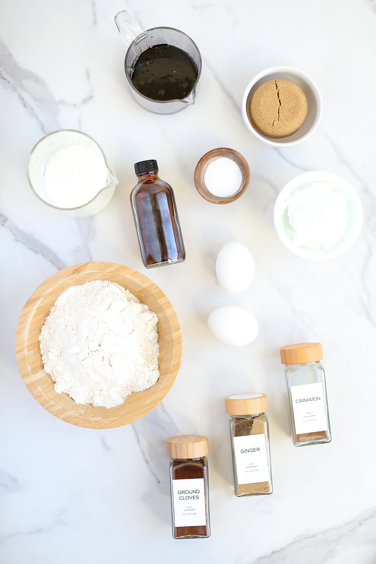 Ingredients needed to make homemade gingerbread muffins.