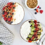 two bowls of cottage cheese with toppings on them