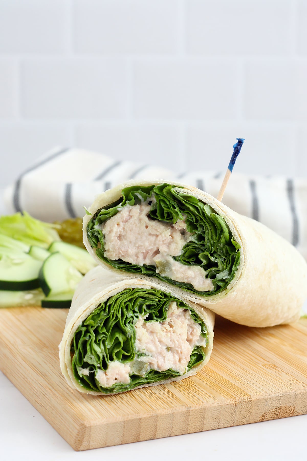 protein packed tuna wrap with fresh veggies and a striped linen