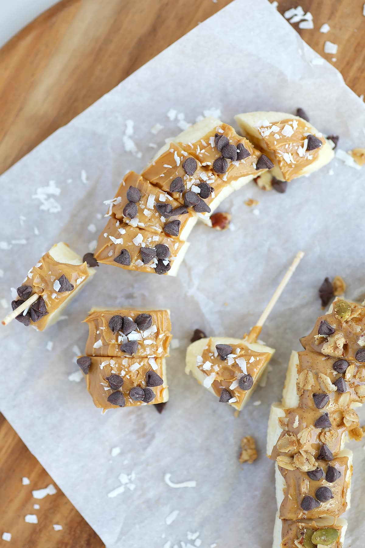 A close up shot of banana sushi snack with coconut and chocolate chips