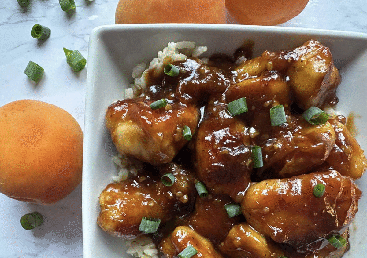 Speedy sticky apricot chicken topped with green onions and served over brown rice