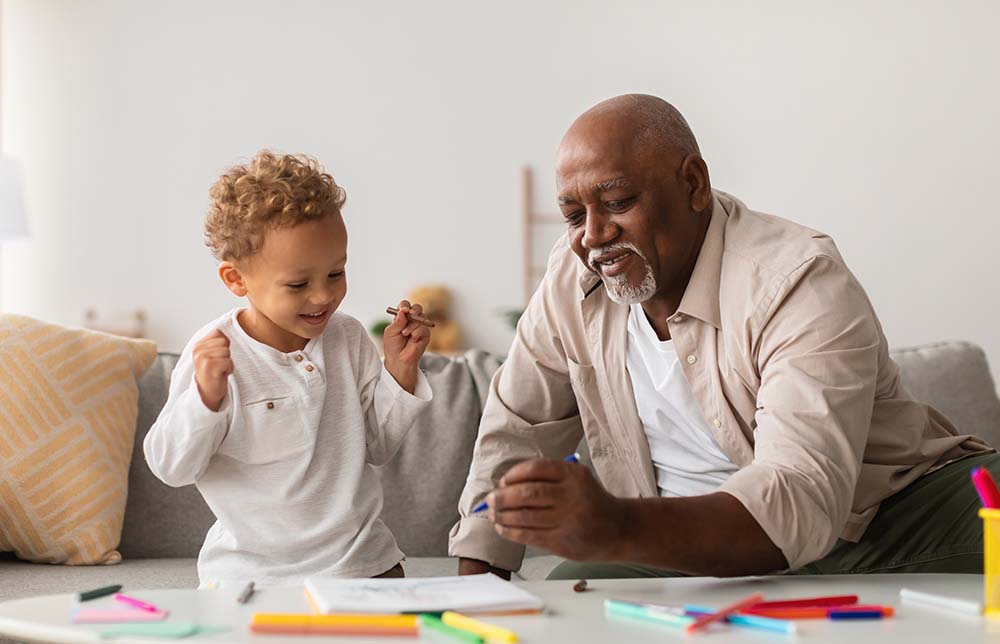 Grandpa helping grandson with back-to-school homework