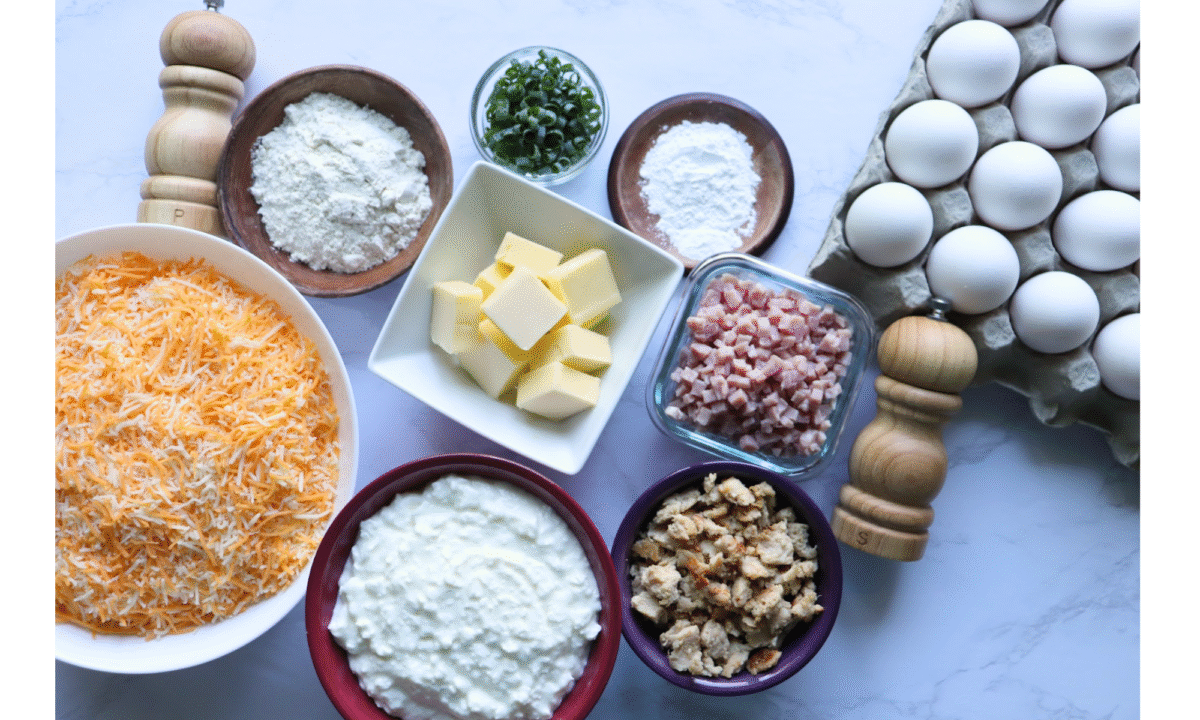 ingredients needed to make breakfast egg puffs on a marble countertop
