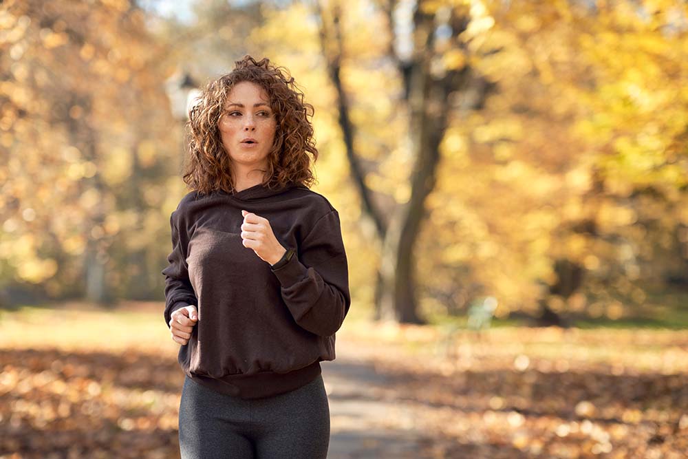 Mother taking a short run for self-care to help with back-to-school stress