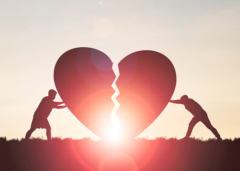 Healing Heart Two people pushing a large heart together, that is cracked down the middle, symbolizing deal with grief