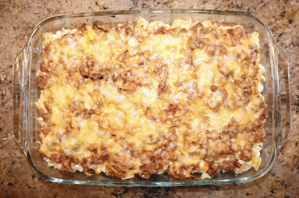 an overhead shot of noodle casserole in a glass baking dish