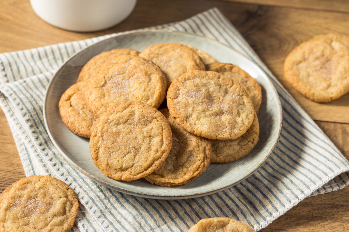 snickerdoodle cookies on a plate with a striped linen