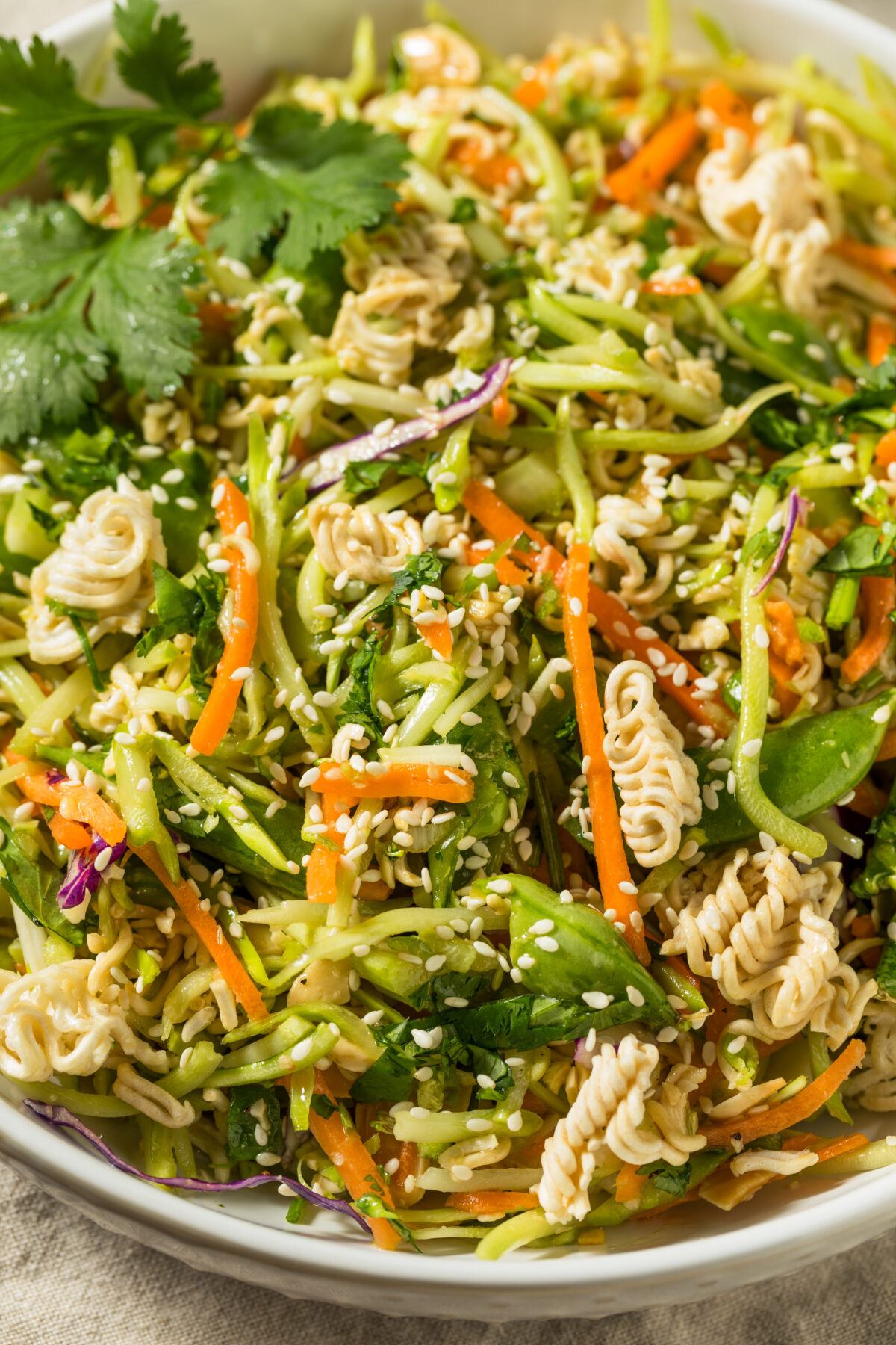 crunchy cabbage salad with ramen noodles in a serving bowl