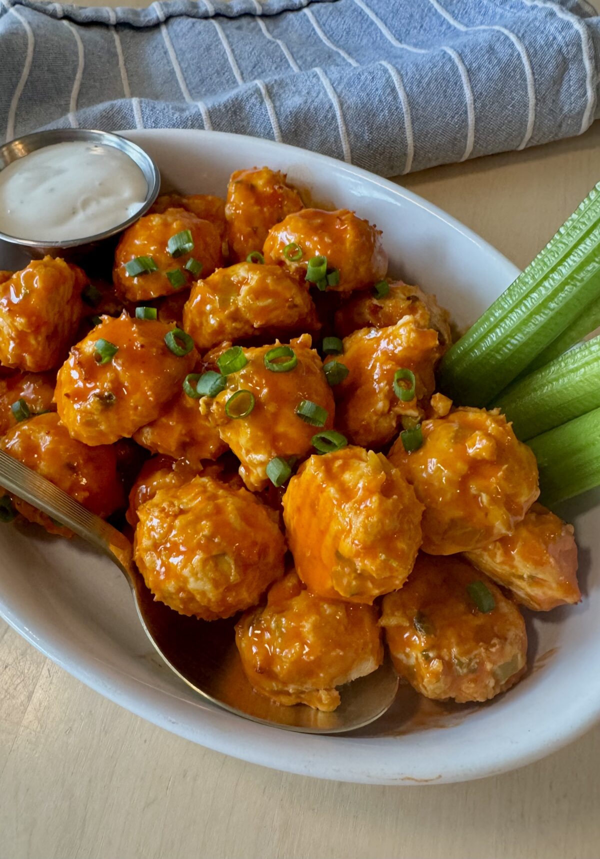 buffalo chicken meatballs with celery sticks and ranch dressing