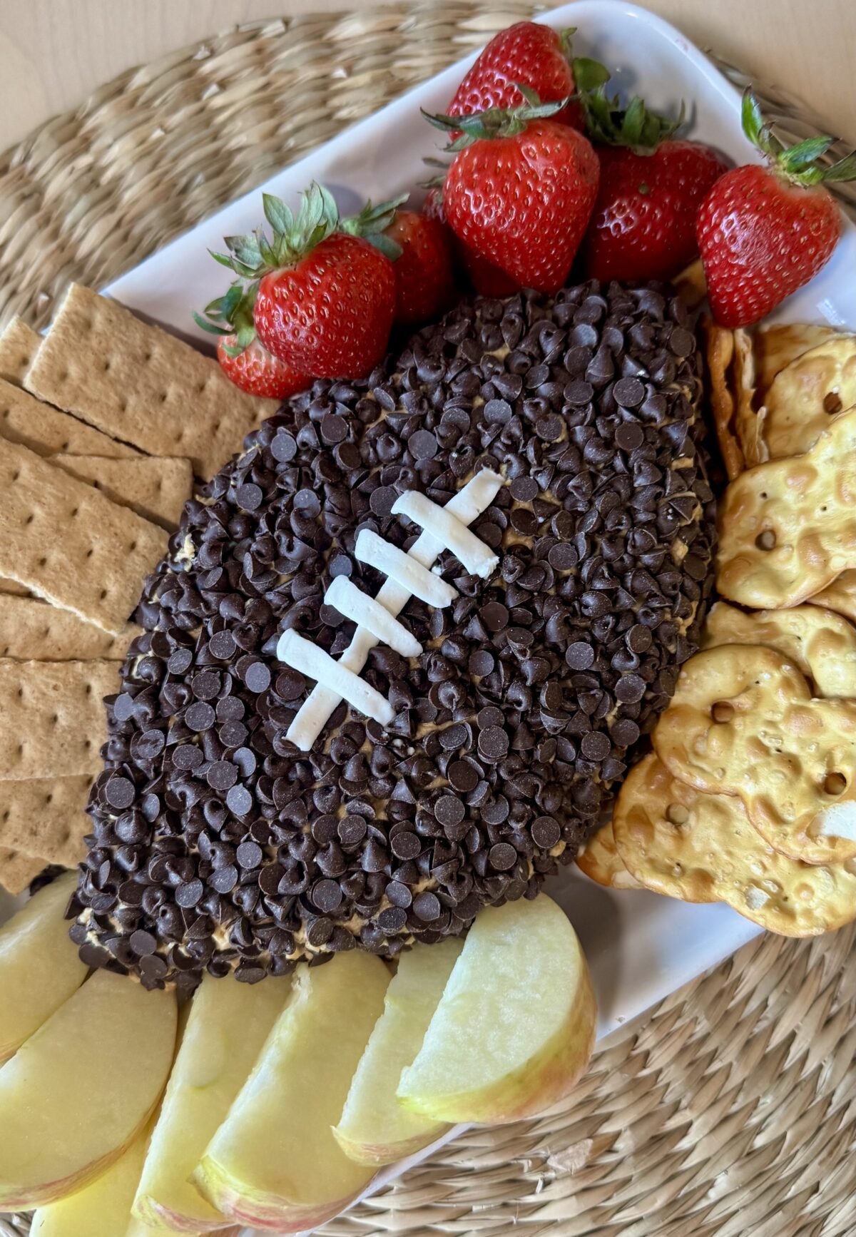 football shaped peanut butter dip covered in mini chocolate chips
