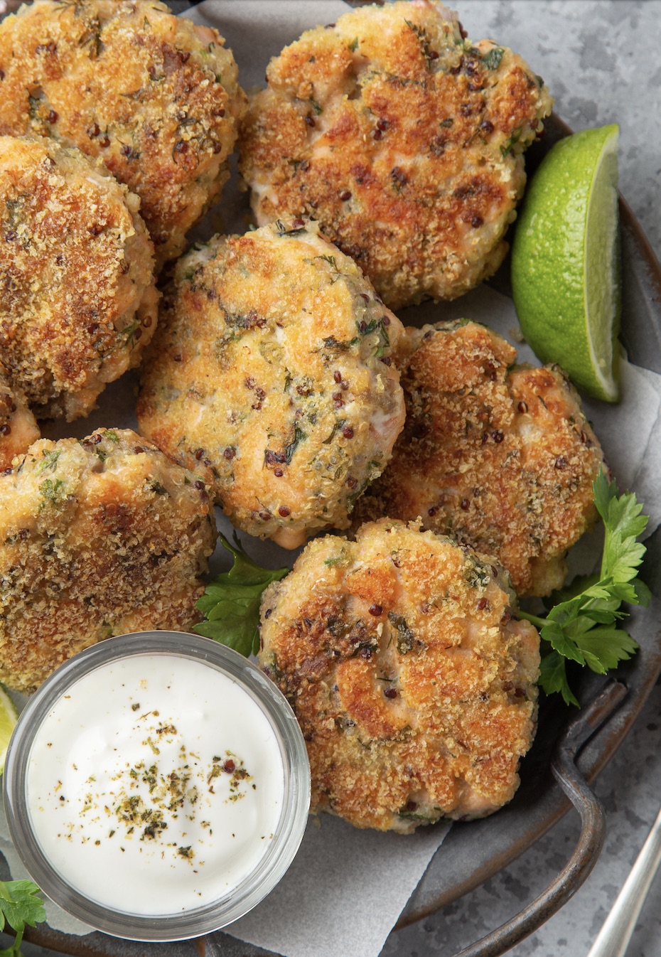 salmon patties with parsley and fresh lime