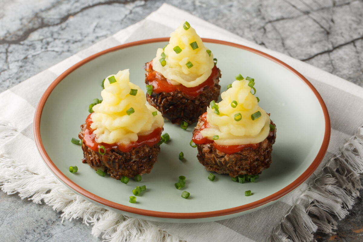 meatloaf cupcakes topped with mashed potatoes and chive "sprinkles"
