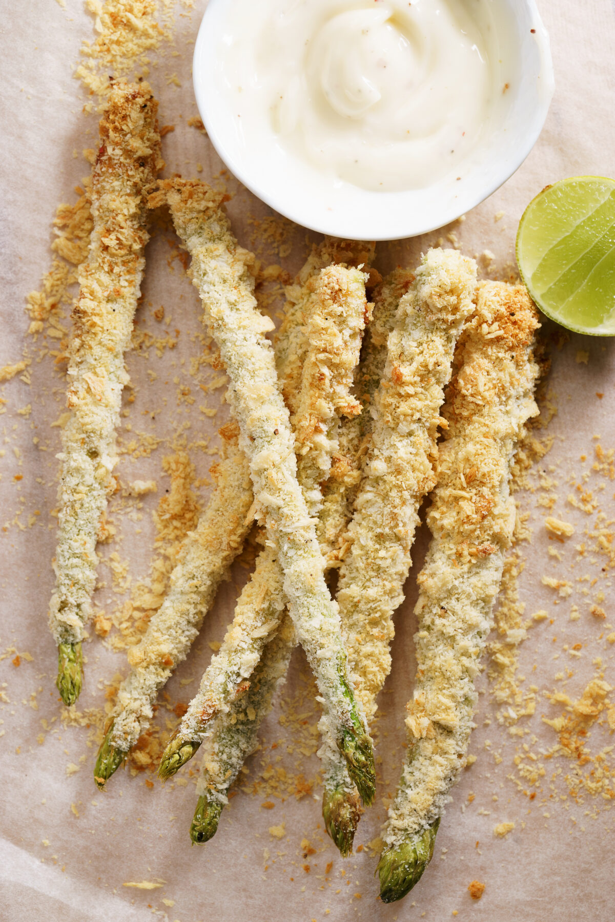 crunchy baked asparagus fries on a sheet of parchment
