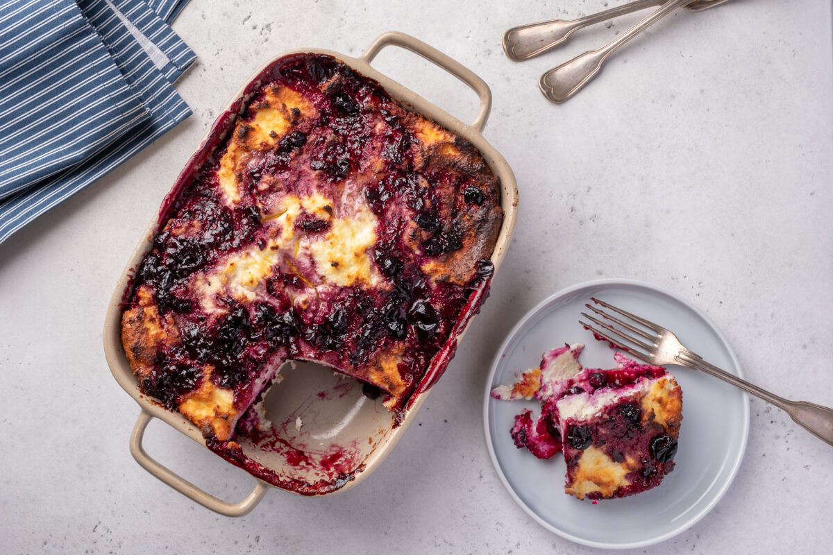 Cottage cheese casserole with blueberries in baking dish