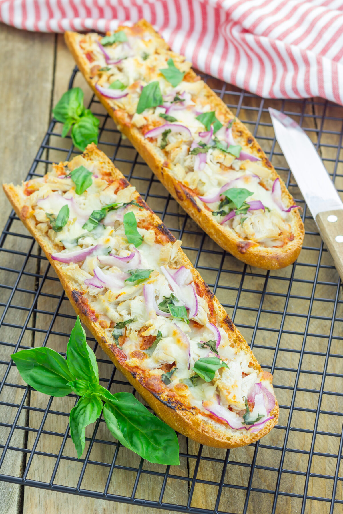 french bread bbq chicken pizza on a wire cooling rack