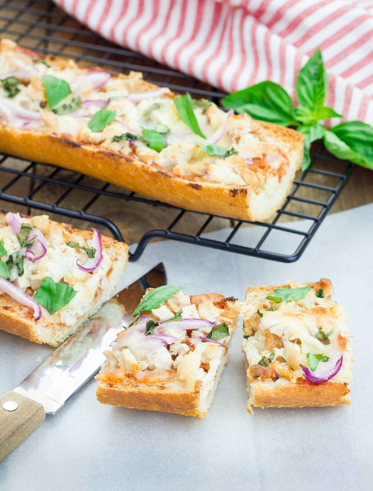 bbq chicken pizza on french bread cut into slices