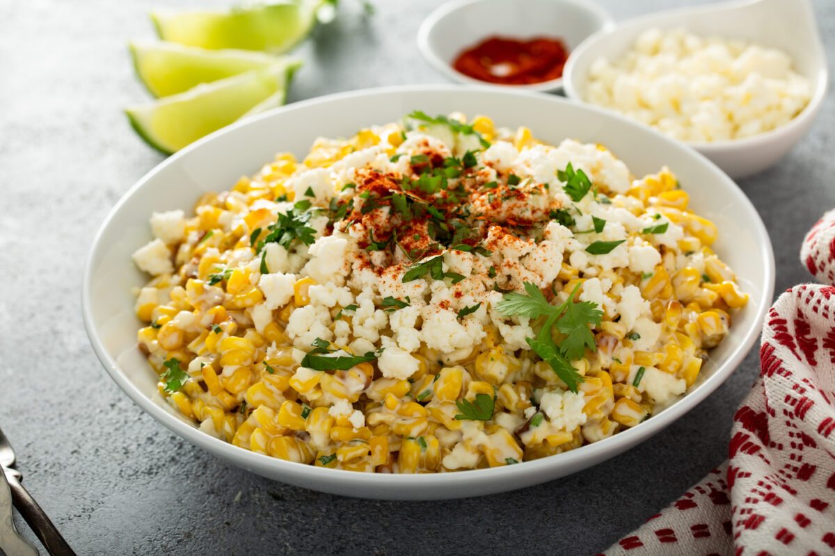 Mexican street corn, elote with cotija cheese, fresh cilantro and chili
