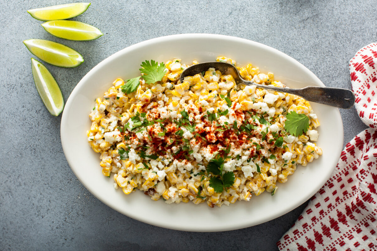 Mexican street corn, elote with cotija cheese, fresh cilantro and chili