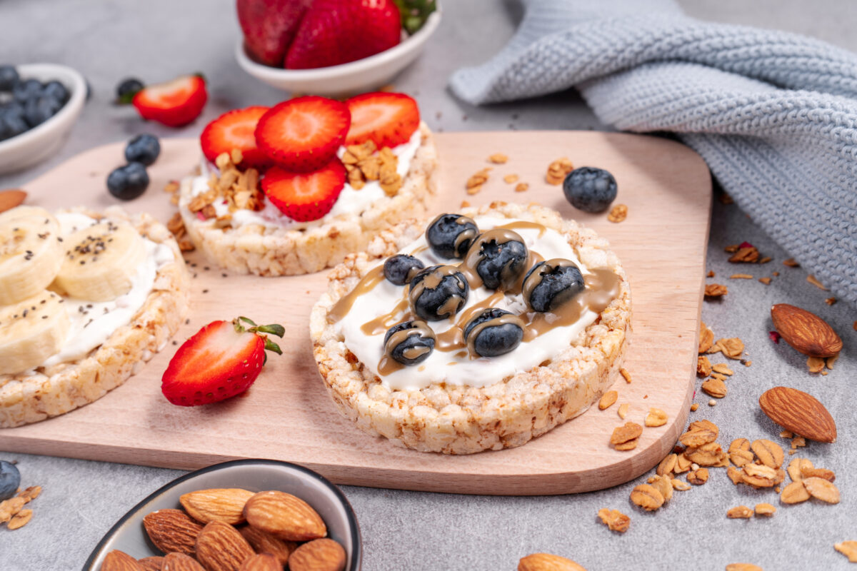 Rice Crackers Snack, Assorted Crackers Topped with Banana, Fresh Berries, Yogurt and Granola