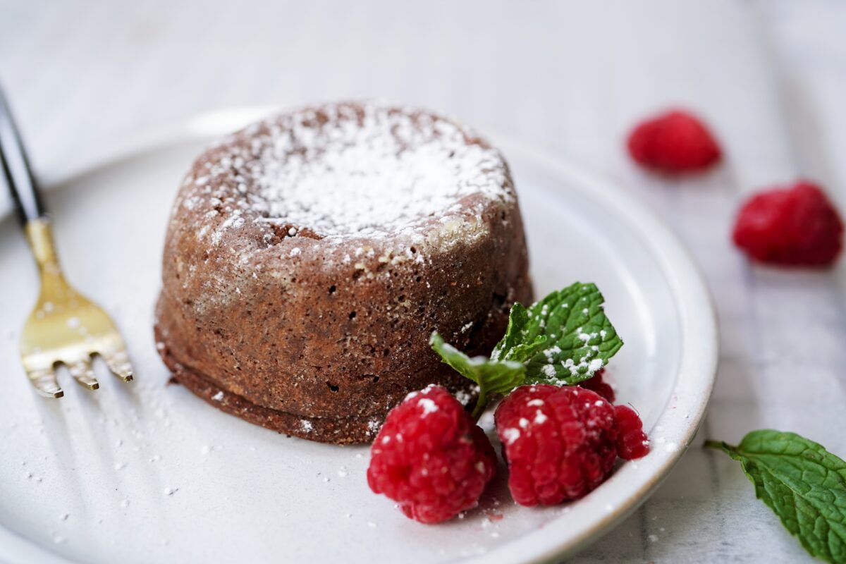 Homemade Chocolate molten lava cake served with raspberries and powdered sugar