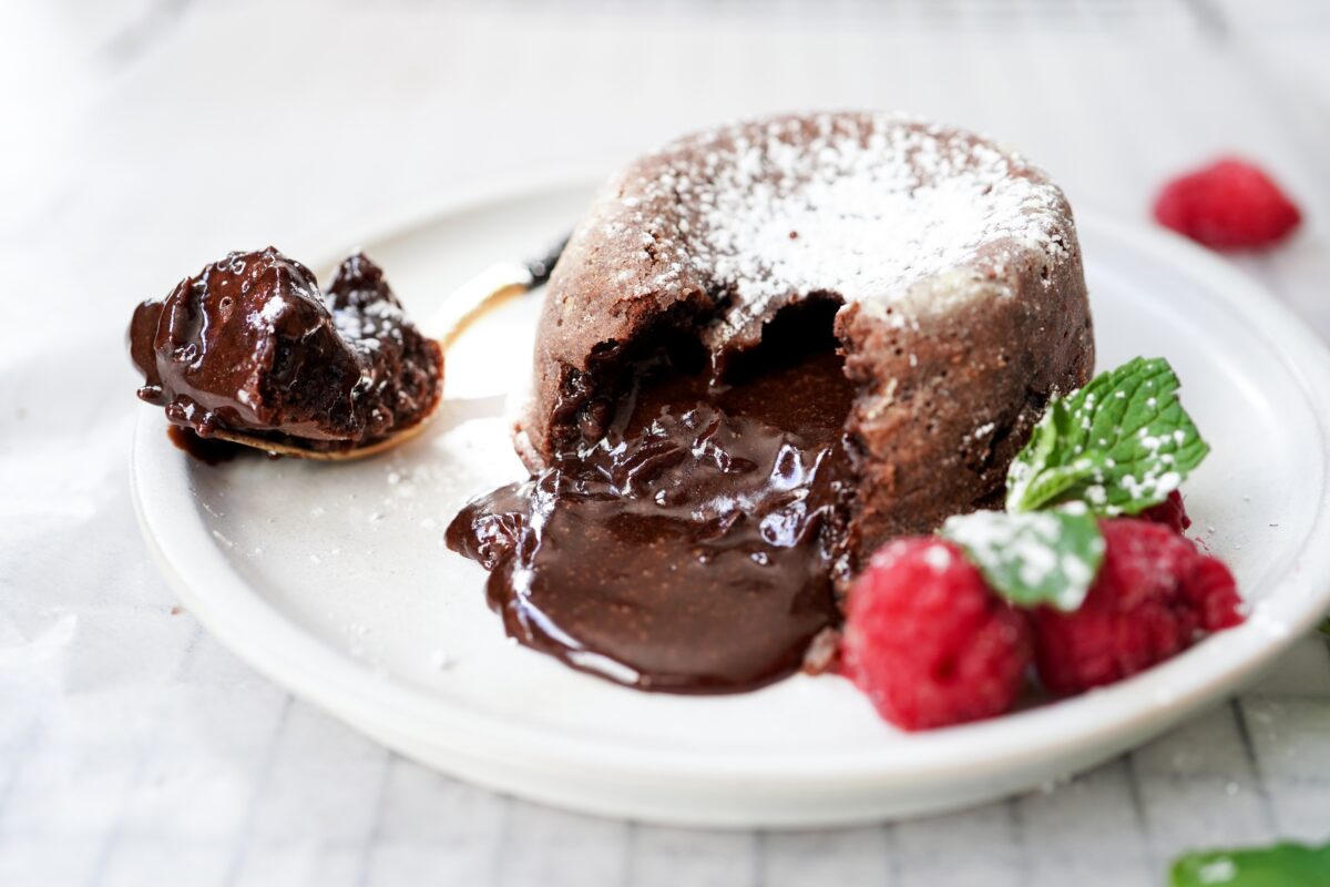 Homemade Chocolate molten lava cake served with raspberries and powdered sugar