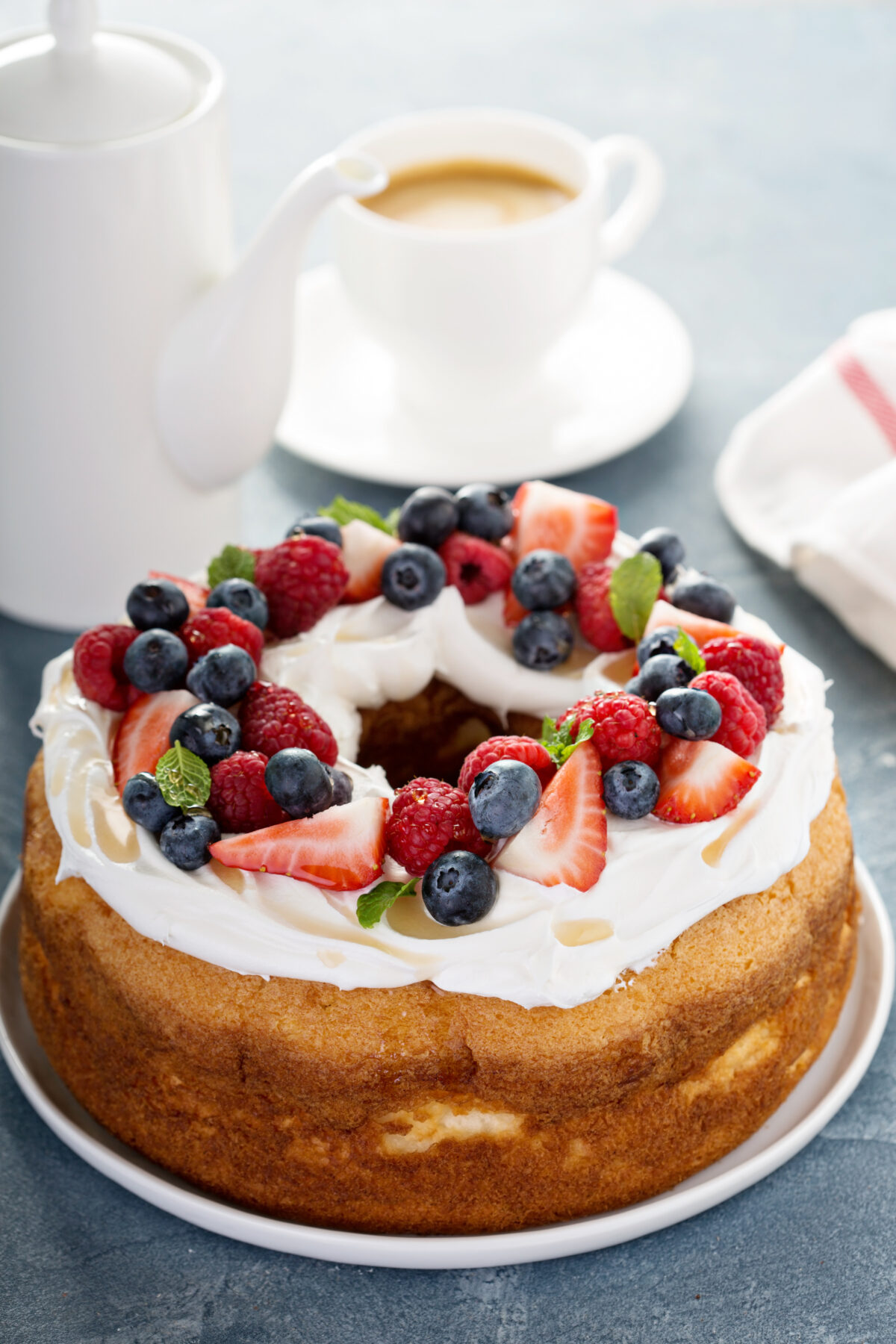Angel food cake with whipped cream and fresh berries