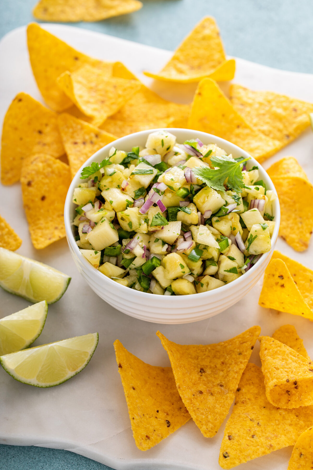 Pineapple salsa with jalapeno, cilantro and red onion served with corn chips