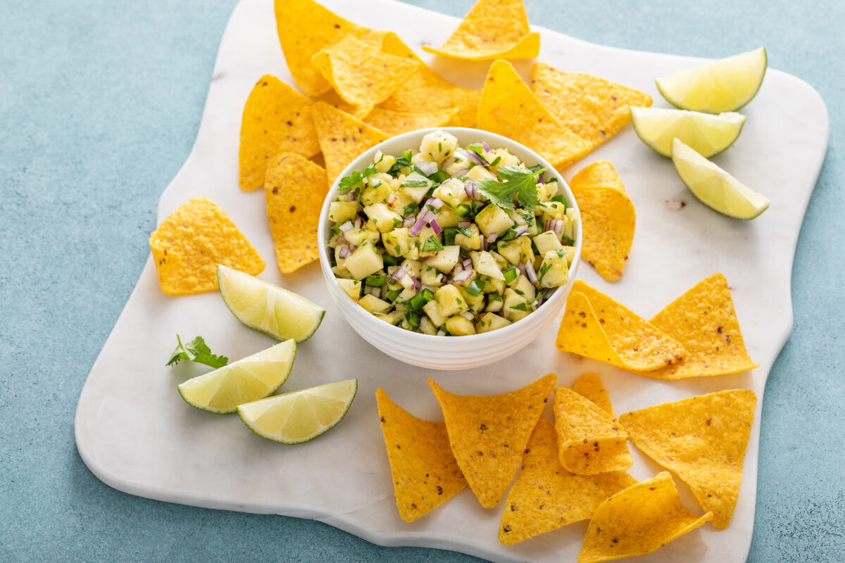 Pineapple salsa with jalapeno, cilantro and red onion served with corn chips