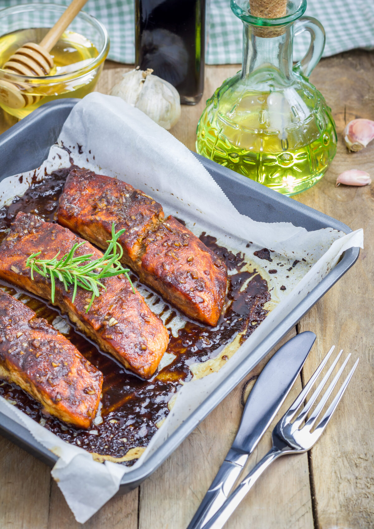 Salmon fillet with balsamic-honey sauce in baking dish, baked